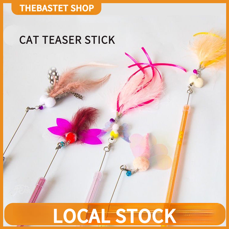 Golden fish retractable cat teaser wand with flowing iridescent ribbon tail for interactive play