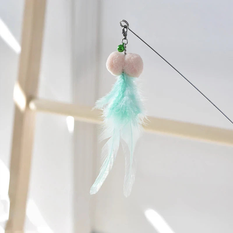 Golden fish retractable cat teaser wand with flowing iridescent ribbon tail for interactive play