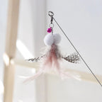 Golden fish retractable cat teaser wand with flowing iridescent ribbon tail for interactive play