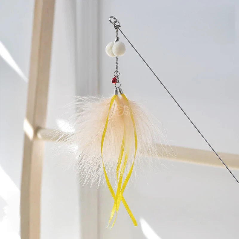 Golden fish retractable cat teaser wand with flowing iridescent ribbon tail for interactive play