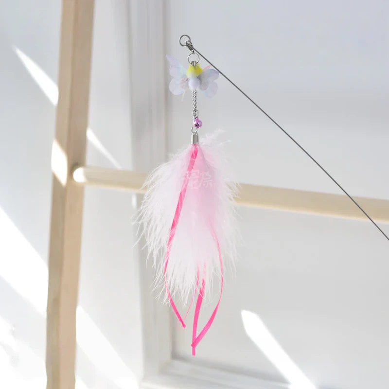 Golden fish retractable cat teaser wand with flowing iridescent ribbon tail for interactive play